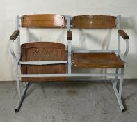 A vintage theatre seats, metal frame with wooden flip seats