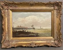 An oil painting of sailing ships off the coast in a gilt frame (33cm x 23cm)