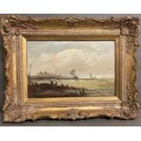 An oil painting of sailing ships off the coast in a gilt frame (33cm x 23cm)