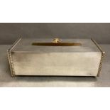 A white metal tissue box bearing the crest of the Sultan of Oman, by Thomas Goode & Co Ltd