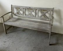 A wooden garden bench with three panels to back (W150cm)