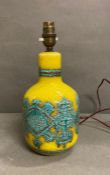An Italian bottle signed table lamp in yellow and teal