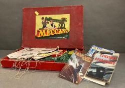 A vintage boxed Meccano set and a selection of Meccano magazine