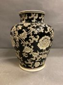 An India Jane of London black painted vase with floral motif