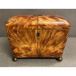 An antique tortoiseshell tea caddy on brass ball feet AF