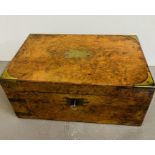 A walnut writing box brass bound. Opening to writing slope, compartments with pearlized handles