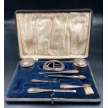 A selection of silver items making up a part vanity set