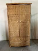 A wicker wardrobe with hanging rail and two drawers under (H184cm W96cm D56cm)
