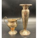 A silver milk jug and a hallmarked silver vase. Approximate Total weight 245g