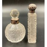 Two silver necked scent bottles.