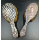 Two hallmarked silver dressing table brushes.