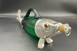 A silver plate and coloured glass decanter in the form of a fish.