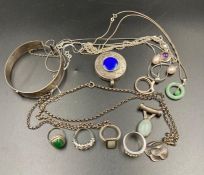 A selection of silver jewellery including a jade pendant