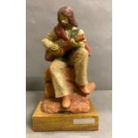 A Josep Bofill sculpture of a man playing guitar