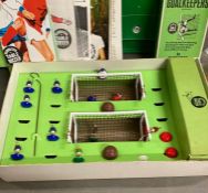 A selection of vintage Subbuteo toys and a Casdon soccer board and players