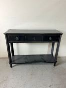 A black console table with three drawers to front (H82cm W110cm D34cm)