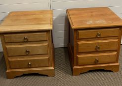 A pair of bedsides with three drawers to both