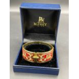 Michaela Frey, Wien. A Viennese enamel bangle with gilt metal mount