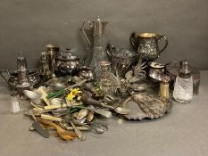 A quantity of silver plate and white metal items to include cutlery, sugar shakers and a claret jug