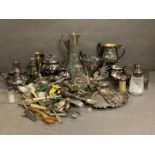 A quantity of silver plate and white metal items to include cutlery, sugar shakers and a claret jug