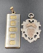 Two pendants, one celebrating Queen Elizabeth II's Silver Jubilee and a antique silver medal.
