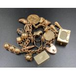 A 9ct gold charm bracelet with a number of charms including an 1896 sovereign.