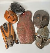 Six wooden and tin tribal masks