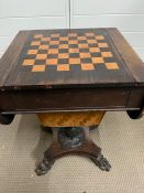 A regency rosewood games table with verso top and hinged sides (H71cm W50cm D44cm)