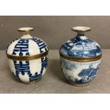 Two hand painted Chinese lidded pots with brass banding