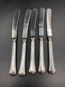 A set of five silver handled butter knives, hallmarked for Sheffield 1918 by Yates Brothers