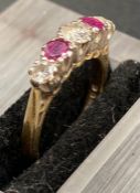 An 18ct gold ring with three diamonds and two rubies alternated.(I1/2)