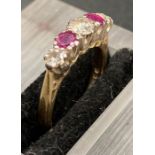 An 18ct gold ring with three diamonds and two rubies alternated.(I1/2)