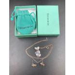 A Tiffany and co silver heart themed necklace and matching earrings