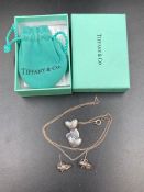 A Tiffany and co silver heart themed necklace and matching earrings