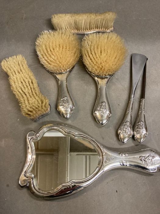 A silver back dressing table set comprising mirror, button hook, shoehorn, two small brushes and two - Image 5 of 5