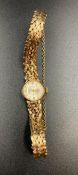A 9ct gold 21 Jewels Rotary ladies watch on 9ct gold bracelet with safety chain.