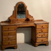 A pine eight drawer dressing table with a pine two drawer vanity mirror (H76cm W146cm D46cm)