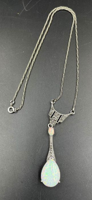 A silver opal and marcasite set necklace.