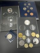 A small selection of collectable coins, Coins of Great Britain pack and medallions.