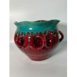 A deep red handles pot with a green drip design around the wave rim (H23cm Dia25cm)