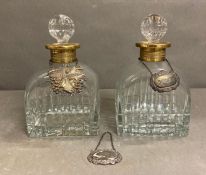 Two French crystal decanters with gilded collars and a hallmarked port decanter tag