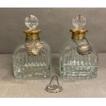 Two French crystal decanters with gilded collars and a hallmarked port decanter tag