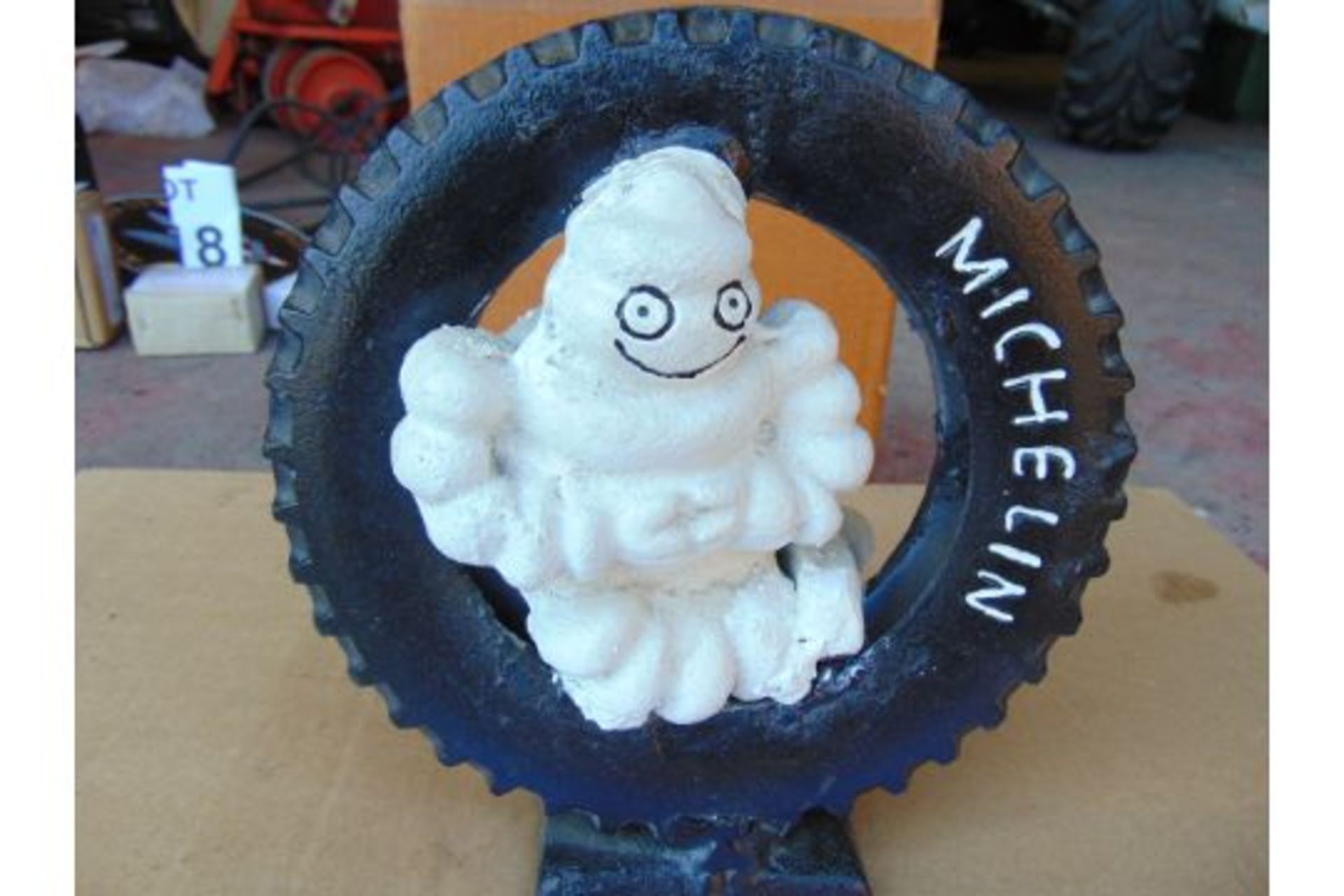 HAND PAINTED CAST IRON MICHELIN MAN SITTING IN TYRE 9 IN X 10 IN