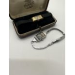 Two watches to include a watch marked 9ct gold, A5M1428 in box by Dunstall & co, watchmakers &