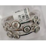 Unusual diamond ring approx 1.50ct, featuring nine round cut diamonds in various sizes set in