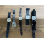 A selection of wristwatches to include a watch with a flip cover of “The Beatles 4 ever” and a