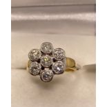 18ct gold and diamond ring with flower design, approx 1.20ct, approx size H, stamped 750