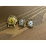 Three vintage watch faces including, a small Swiss made rectangular watch face, marked 375 Parex,
