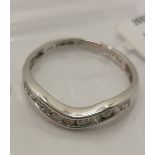 White gold and diamond ring, featuring a row of x11 round cut diamonds, approx gross 0.25cts,