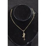 Bespoke 18ct yellow gold gecko/lizard pendant with 14 eight cut diamonds along the spine approx. .